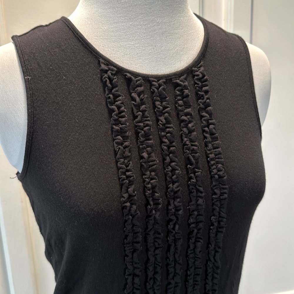 Black access tank with adorable ruffle detail down front sz medium preowned.